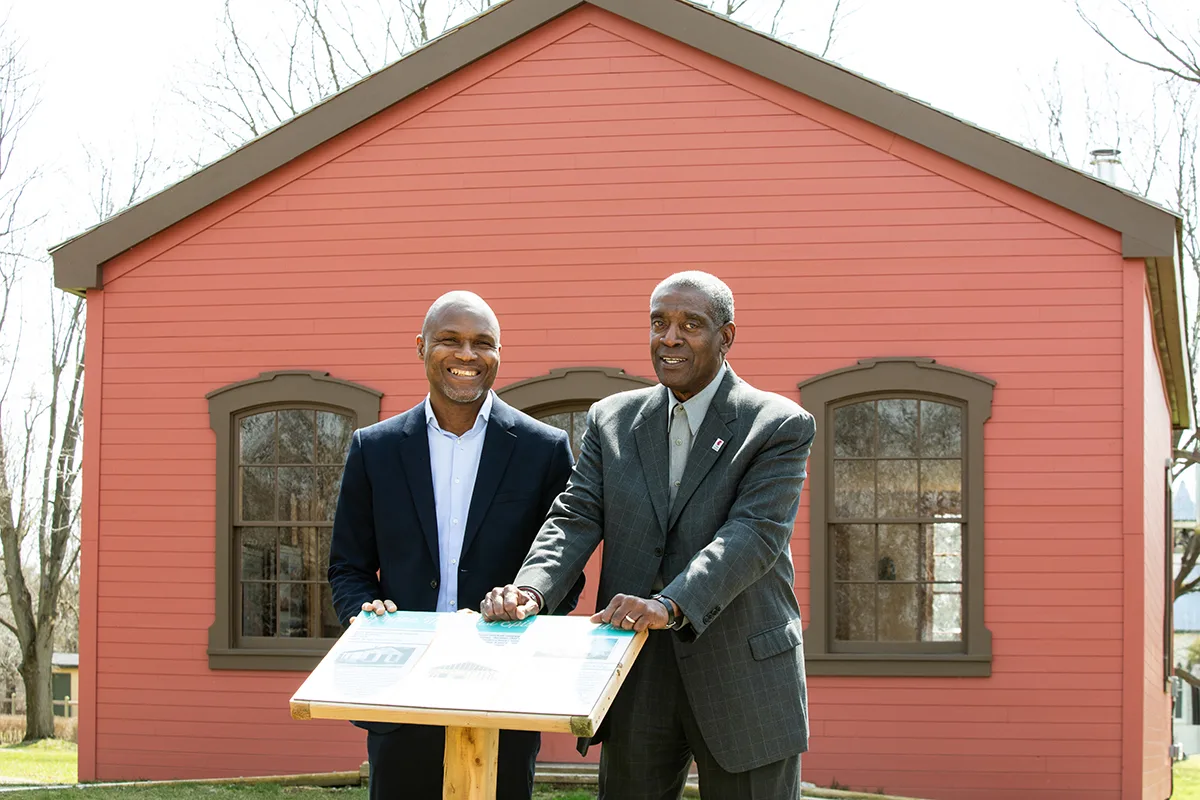Two men presenting behind a lectern